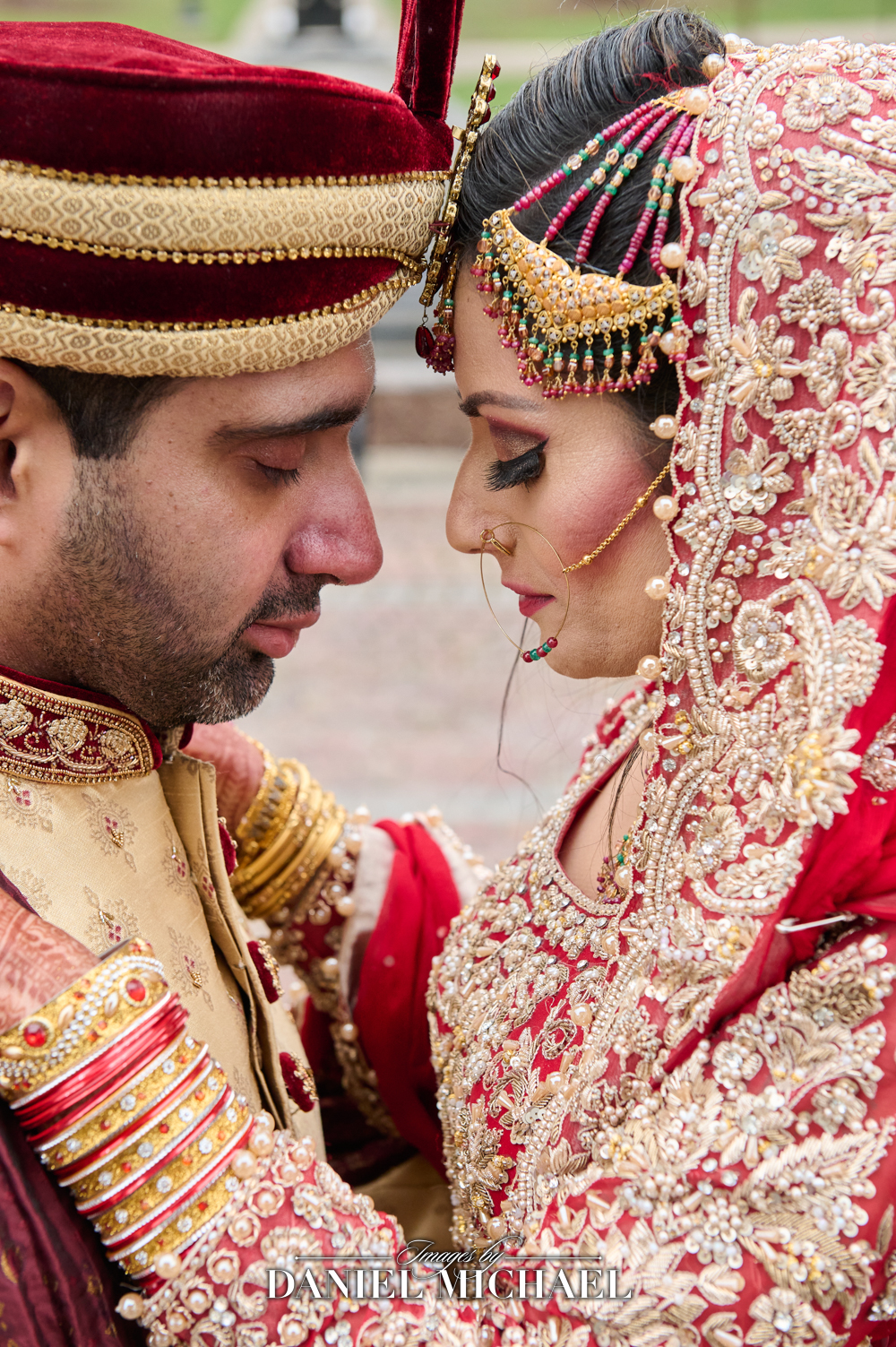 South Asian Muslim couple in traditional wedding attire, with the bride in a richly embroidered lehenga and the groom in a sherwani